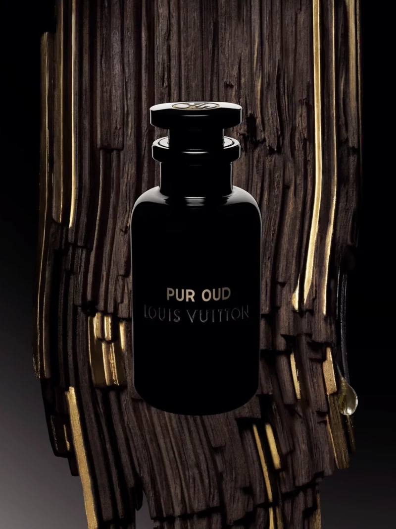 pur oud louis vuitton minimal black bottle in front of gold accented wood backdrop